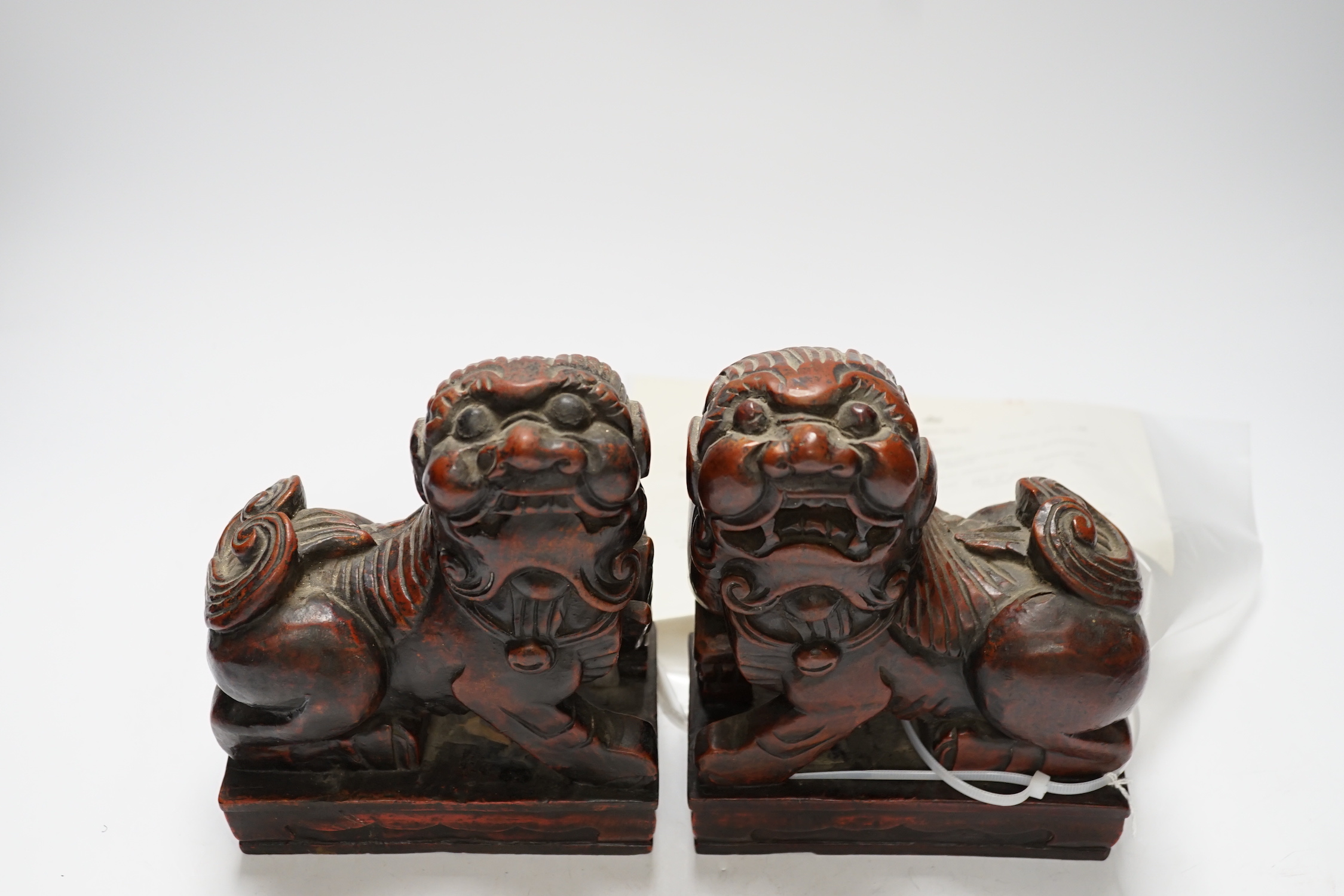 Two Japanese carved and lacquered hardwood Temple dogs, late Tokugawa period, 16cm wide